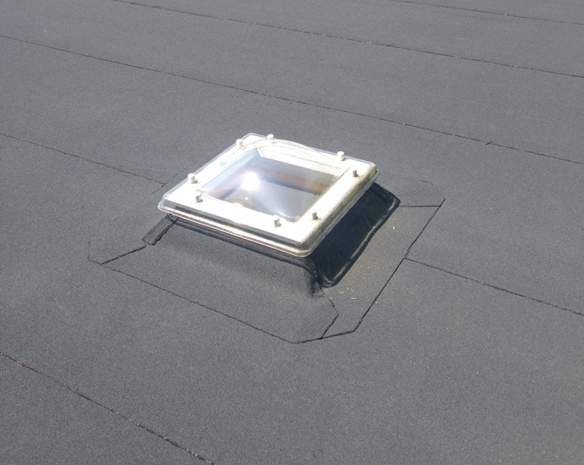 lichtkoepel op plat dak