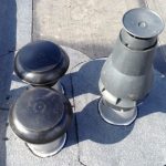 Plat dak vernieuwen om ventilatie heen